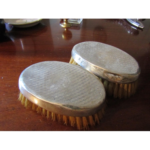 56 - Pair of Silver Mounted Brushes Oval Form