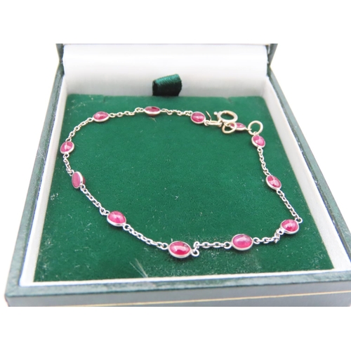 120 - 18 Carat Yellow Gold Ladies Bracelet with Cabochon Cut Ruby Insets Approximately 18cm Long