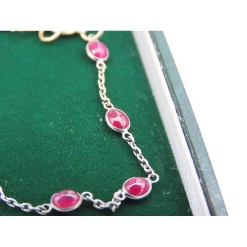 120 - 18 Carat Yellow Gold Ladies Bracelet with Cabochon Cut Ruby Insets Approximately 18cm Long