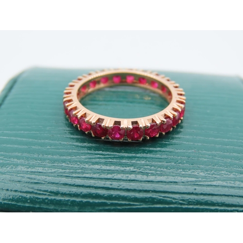 169 - 18 Carat Yellow Gold Set Ruby Eternity Ring Size K Rubies Approximately 2 Carats