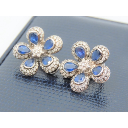 195 - Pair of Diamond and Sapphire Set Ladies Flower Motif Earrings Mounted on 18 Carat White Gold