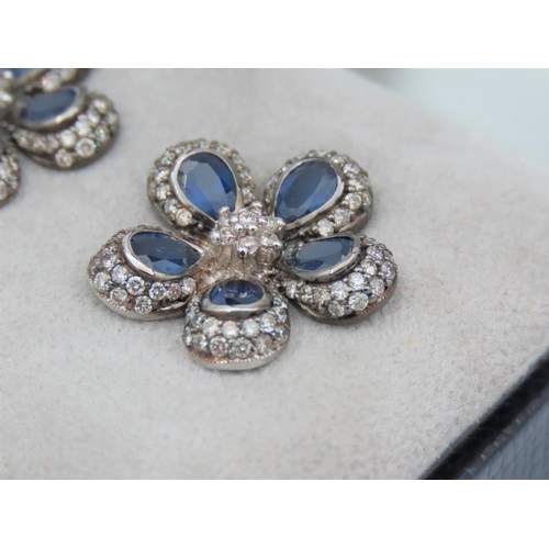 195 - Pair of Diamond and Sapphire Set Ladies Flower Motif Earrings Mounted on 18 Carat White Gold