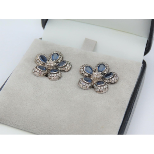 195 - Pair of Diamond and Sapphire Set Ladies Flower Motif Earrings Mounted on 18 Carat White Gold