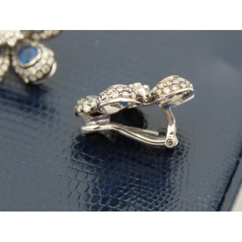 195 - Pair of Diamond and Sapphire Set Ladies Flower Motif Earrings Mounted on 18 Carat White Gold