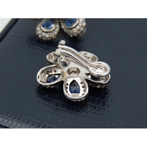 195 - Pair of Diamond and Sapphire Set Ladies Flower Motif Earrings Mounted on 18 Carat White Gold