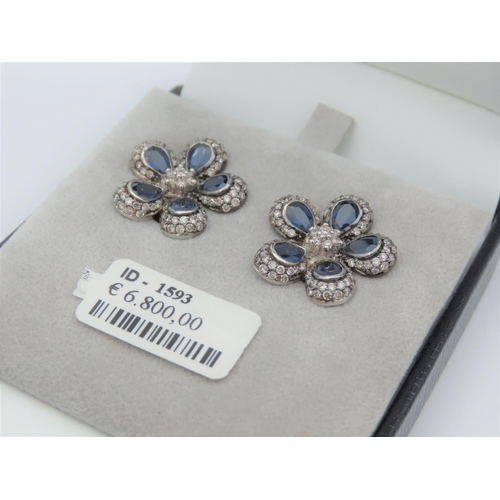 195 - Pair of Diamond and Sapphire Set Ladies Flower Motif Earrings Mounted on 18 Carat White Gold