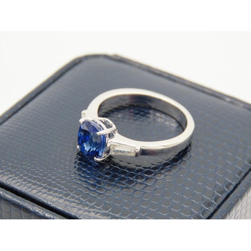 241 - Ladies Solitaire Sapphire Ring with Baguette Cut Diamond Shoulders Mounted on 18 Carat White Gold Ba... 