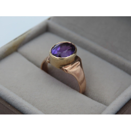 391 - Amethyst Oval Cut Ladies Centre Stone Ring Mounted on 9 Carat Yellow Gold Band Ring Size N and a Hal... 