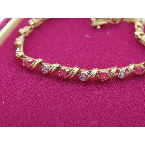 392 - Ruby and Diamond Ladies Bracelet Articulated Form Mounted on 9 Carat Yellow Gold