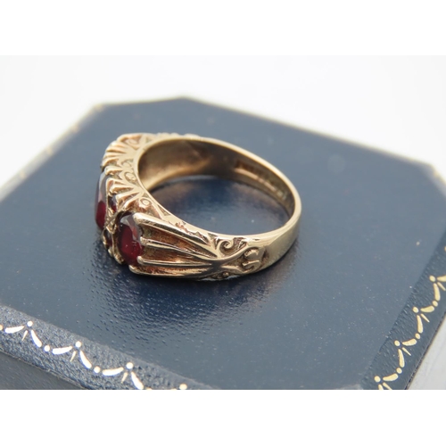 395 - Garnet Three Stone Ring Mounted on 9 Carat Yellow Gold Band Attractively Chased and Detailed Ring Si... 