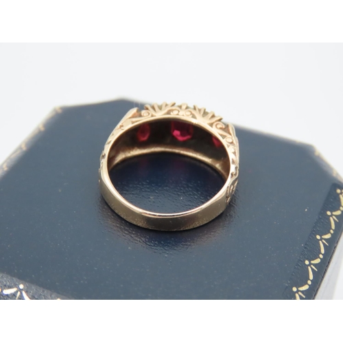 395 - Garnet Three Stone Ring Mounted on 9 Carat Yellow Gold Band Attractively Chased and Detailed Ring Si... 