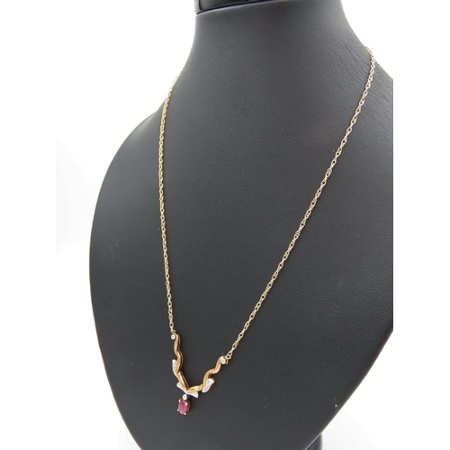 403 - 9 Carat Yellow Gold Ruby and Diamond Pendant Necklace of Attractive Form Four Claw Setting to Ruby