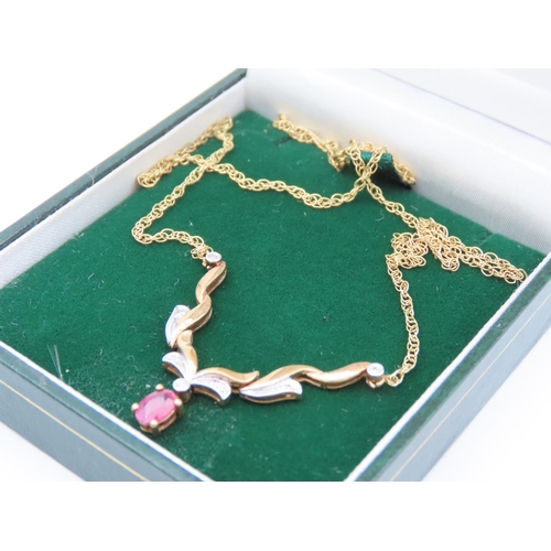 403 - 9 Carat Yellow Gold Ruby and Diamond Pendant Necklace of Attractive Form Four Claw Setting to Ruby