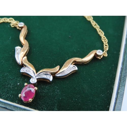 403 - 9 Carat Yellow Gold Ruby and Diamond Pendant Necklace of Attractive Form Four Claw Setting to Ruby