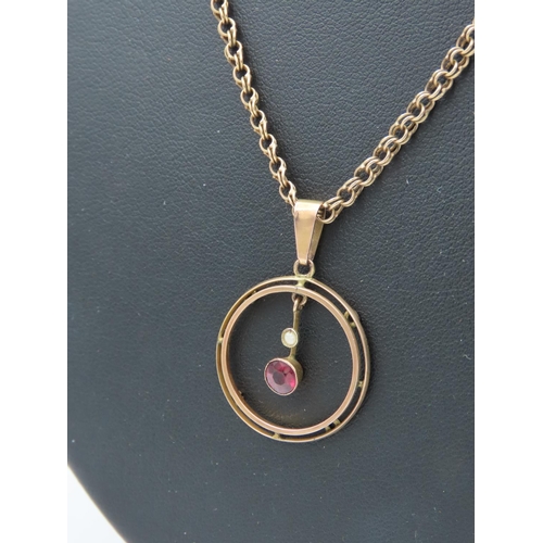 426 - 9 Carat Yellow Gold Open Form Circular Ruby and Seed Pearl Decorated Drop Pendant Together with Link... 