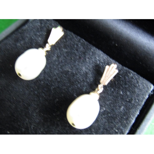 489 - Pair of 14 Carat Yellow Gold Set Pearl Earrings