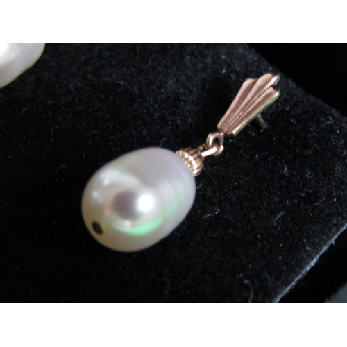 489 - Pair of 14 Carat Yellow Gold Set Pearl Earrings