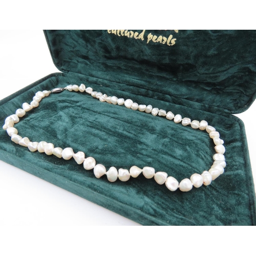 57 - Ladies Natural Pearl Necklace with Silver Clasp Contained within Presentation Box