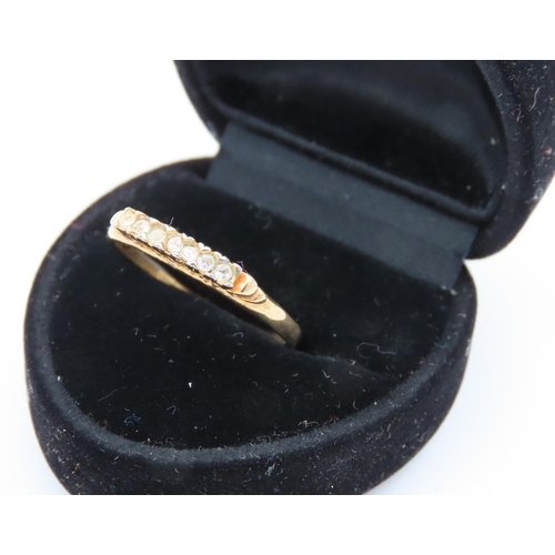8 - Seven Diamond Ladies Line Ring Mounted on 18 Carat Yellow Gold Ring Size R and a Half
