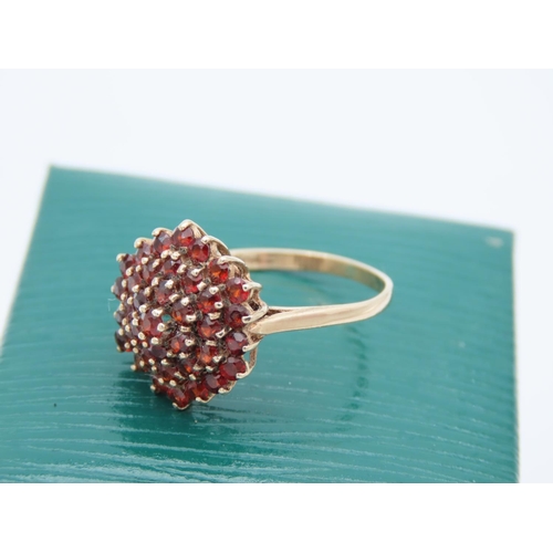 83 - Ladies Ruby Cluster Ring Mounted on 9 Carat Yellow Gold Band Ring Size O