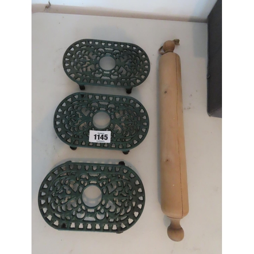 1145 - Three Metal Vintage Trivets and Antique Rolling Pin