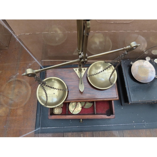 1240 - Two Sets of Balance Scales Contained in Acrylic Display Case Measuring Approximately 23 Inches Wide ... 