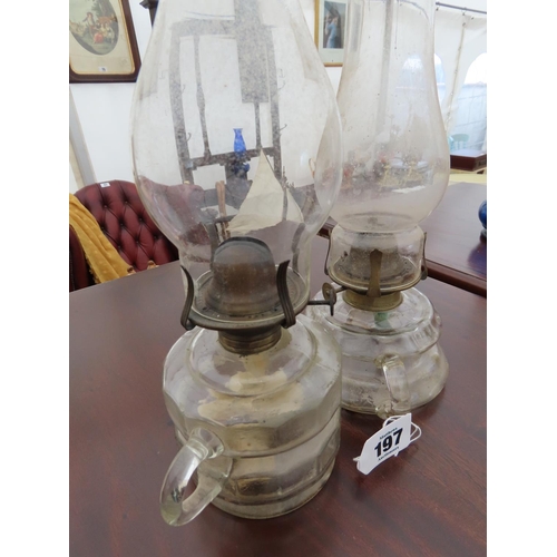 197 - Pair of Antique Clear Glass Paraffin Lamps with Integral Carrying Handle Tallest 12 Inches