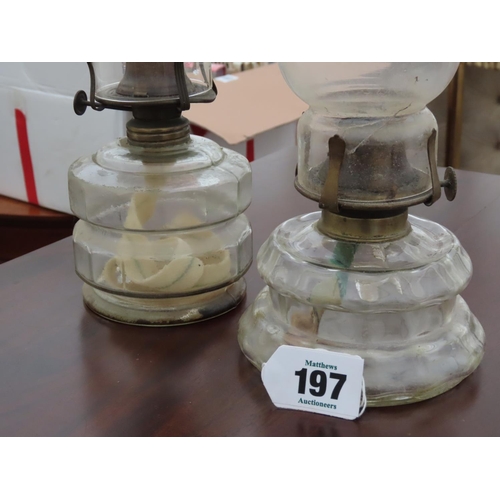 197 - Pair of Antique Clear Glass Paraffin Lamps with Integral Carrying Handle Tallest 12 Inches