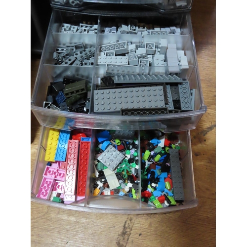 320 - Set of Eight Stacking Shelf Units Containing a Large Quantity of Lego Pieces