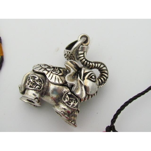 596 - Selection of Chinese Pendants in Jade and Coral Colourings with Tibetan Silver Elephant