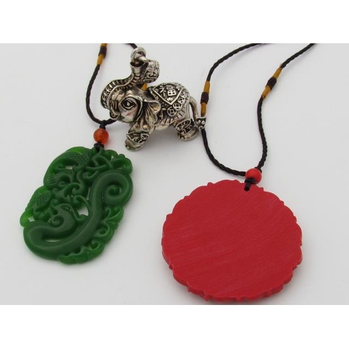 596 - Selection of Chinese Pendants in Jade and Coral Colourings with Tibetan Silver Elephant