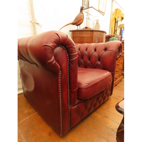 70 - Burgundy Chesterfield Club Chair Approximately 40 Inches Wide x 27 Inches Tall