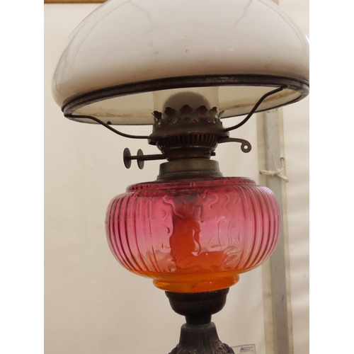 89 - Victorian Oil Lamp with Cast Iron Base and Milk Glass Shade Approximately 22 Inches Tall