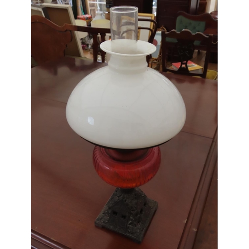 89 - Victorian Oil Lamp with Cast Iron Base and Milk Glass Shade Approximately 22 Inches Tall