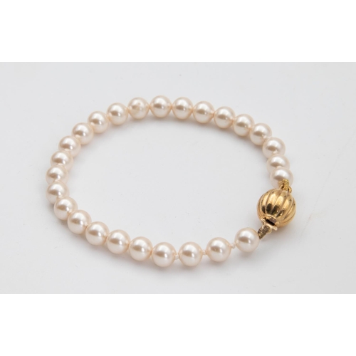 67 - Single Row Uniform Simulated Pearl Ladies Bracelet Good Condition with Gilt Metal Safety Clasp