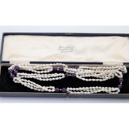 82 - Cultured Freshwater Rice Pearl and Amethyst Bead Set Ladies Necklace of Attractive Form