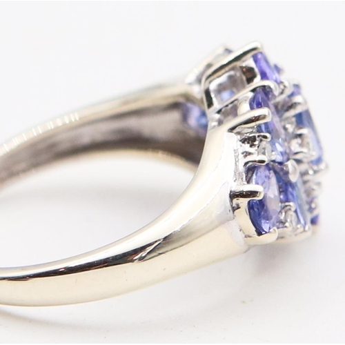 85 - Tanzanite Ladies Cluster Ring Mounted on 9 Carat White Gold Ring Size H and a Half