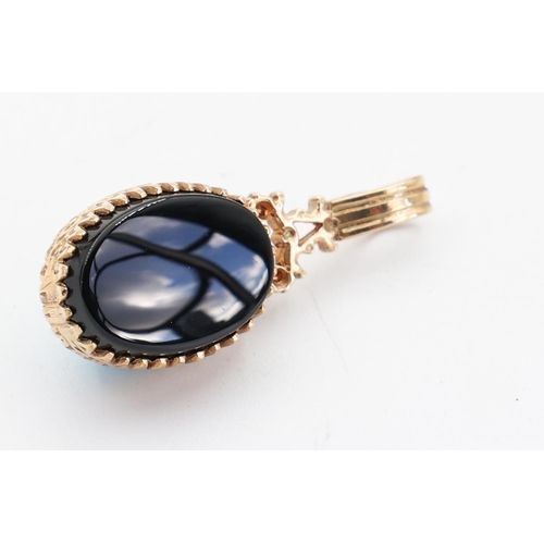 133 - Onyx and Turquoise Double Sided Ladies Pendant Mounted on 9 Carat Yellow Gold Attractively Detailed