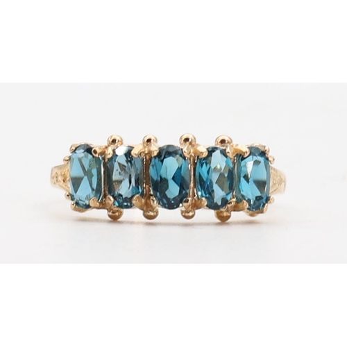 138 - Five Stone Ladies Blue Topaz Ring Mounted on 9 Carat Yellow Gold Ring Size O and a Half