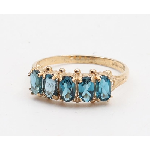 138 - Five Stone Ladies Blue Topaz Ring Mounted on 9 Carat Yellow Gold Ring Size O and a Half