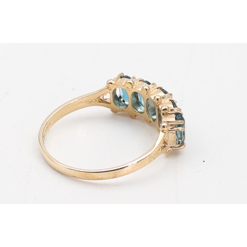 138 - Five Stone Ladies Blue Topaz Ring Mounted on 9 Carat Yellow Gold Ring Size O and a Half