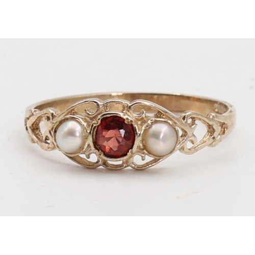 142 - Garnet and Pearl Set Ladies 9 Carat Yellow Gold Ring Size O and a Half