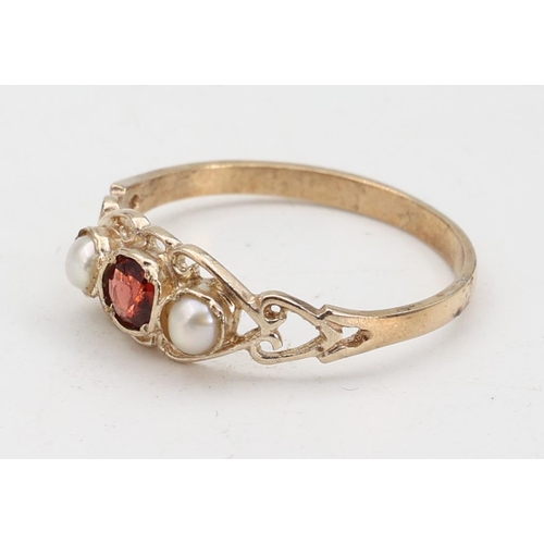 142 - Garnet and Pearl Set Ladies 9 Carat Yellow Gold Ring Size O and a Half