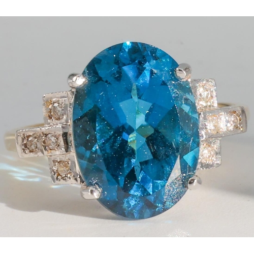 187 - Blue Topaz and Diamond Set Ladies Ring Mounted on 18 Carat Yellow Gold Ring Size O