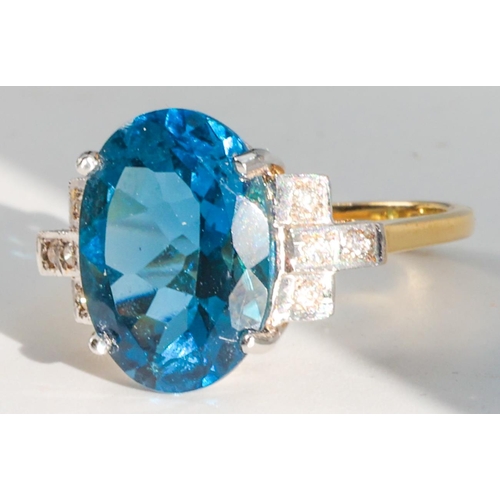 187 - Blue Topaz and Diamond Set Ladies Ring Mounted on 18 Carat Yellow Gold Ring Size O