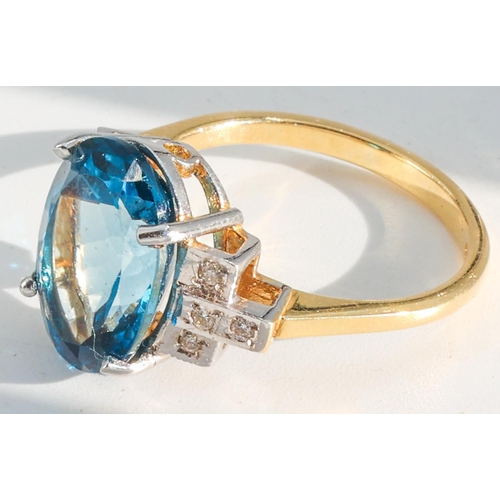 187 - Blue Topaz and Diamond Set Ladies Ring Mounted on 18 Carat Yellow Gold Ring Size O