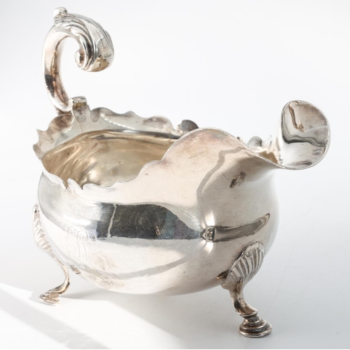 208 - Silver Sauceboat Shaped Form Handle above Well Formed Rim