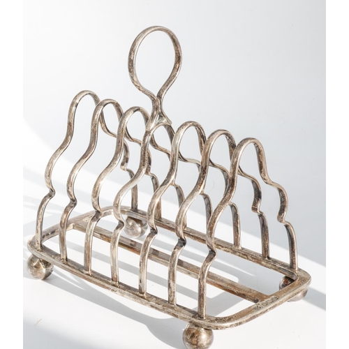 223 - Edwardian Silver Toast Rack Oblong Form with Seven Shaped Bars and Circular Loop Handle Raised Upon ... 