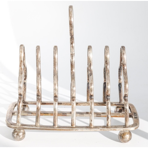 223 - Edwardian Silver Toast Rack Oblong Form with Seven Shaped Bars and Circular Loop Handle Raised Upon ... 