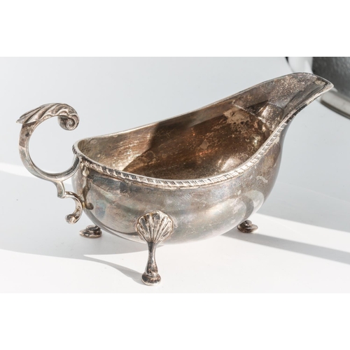 224 - Silver Sauceboat with Gadrooned Rim Decoration and Leaf Capped Flying Scroll Handle